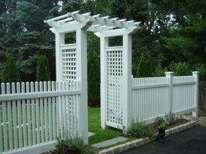 Archway Trellis by a white picket fence